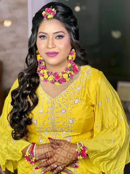 A bright and joyful shot of the bride, looking radiant and ready for her Haldi celebrations.