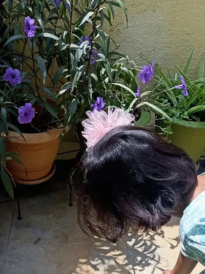 Another candid shot of a child connecting with nature.