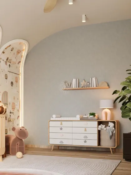 The nursery design includes a changing table with ample storage and open shelving for easy access to essentials. The furniture has soft, rounded edges for safety.