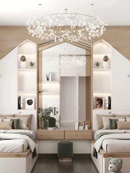 A beautiful shared bedroom for two, featuring house-shaped headboards with built-in lights and a central dressing table.