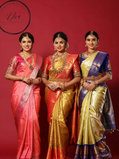 A group portrait showcasing a variety of traditional South Indian bridal looks. From the fully decked-out bride in the center to the elegant bridesmaids, this image shows my ability to style for an entire bridal party.