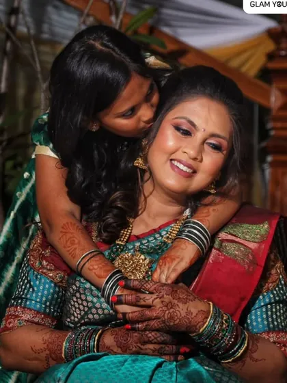This photo shows the power of a good makeup artist. Even after 10 hours, in any light, the makeover looks fresh, chic, and classic. This candid moment with her daughter is just precious.