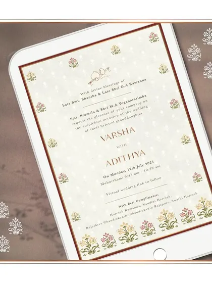 An elegant e-invitation with a minimalist design. It features traditional Indian floral motifs in a subtle, repeating pattern, perfect for a classic and sophisticated virtual wedding announcement.