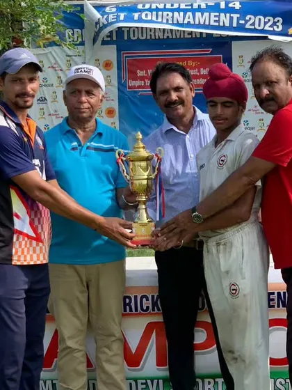 The captain receiving the championship trophy. Leading a team to victory is a huge responsibility and a massive achievement for a young player.