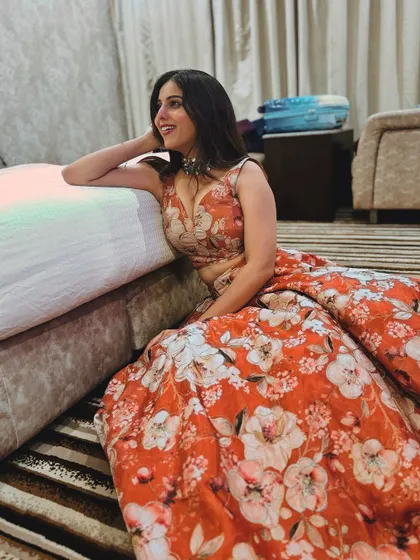 A final, beautiful shot of the client in her custom floral lehenga.