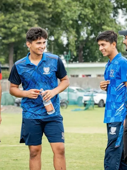 Some chit-chat with the boys. Building rapport and trust is a huge part of being a successful coach.