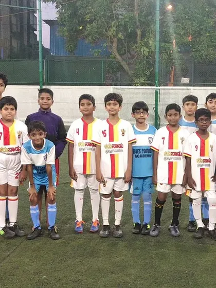 The U9 teams of Karunadu FC and Blues Football Academy pose together, showcasing the spirit of grassroots football.