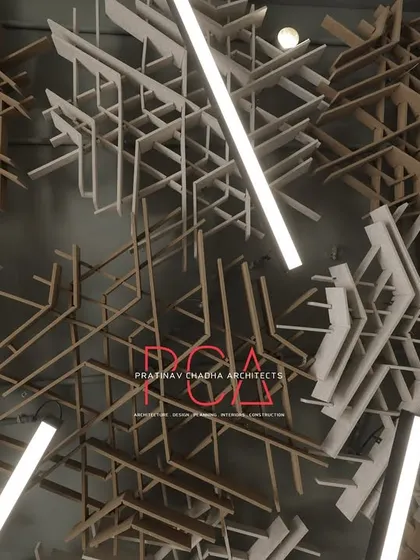 A detailed close-up of the interweaving acoustic ceiling panels designed for the StyleIn Homes office. This image highlights the complexity and artistic nature of the custom ceiling, which serves as a primary design feature while also providing functional sound dampening for the workspace.