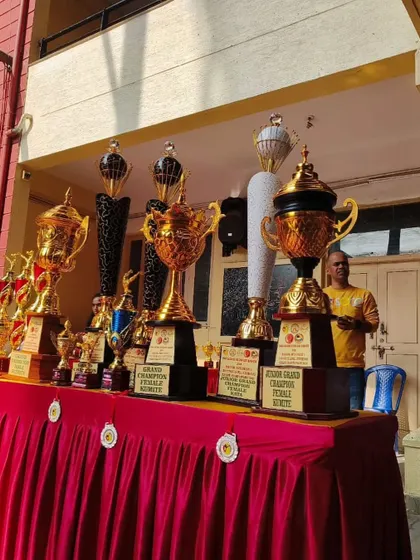 A table full of trophies at our 13th state-level championship. Each one represents a story of perseverance and the pursuit of excellence by our dedicated students.
