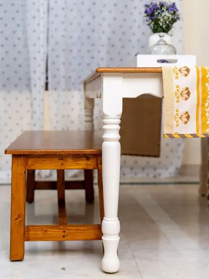 A dining table paired with a bench is a great way to create a more casual and flexible seating arrangement.