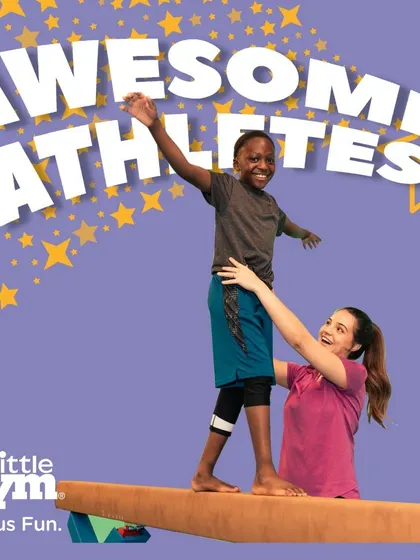 With an instructor's guidance, this young athlete learns to balance on the beam. This activity builds not just physical stability but also the mental focus required for more advanced gymnastics.