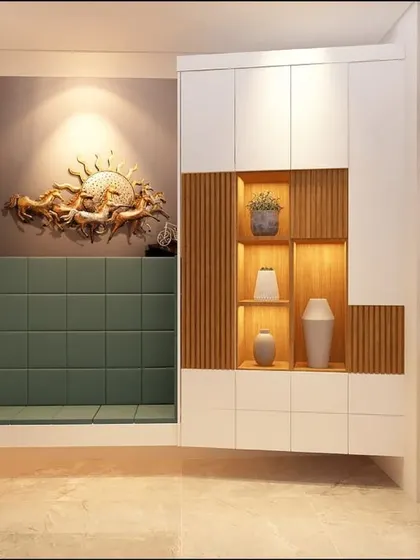 The foyer of our 'Panchsheel Towers' project in Pune. A stunning sun-themed wall sculpture is the focal point, complemented by a comfortable seating nook and a stylish storage unit.