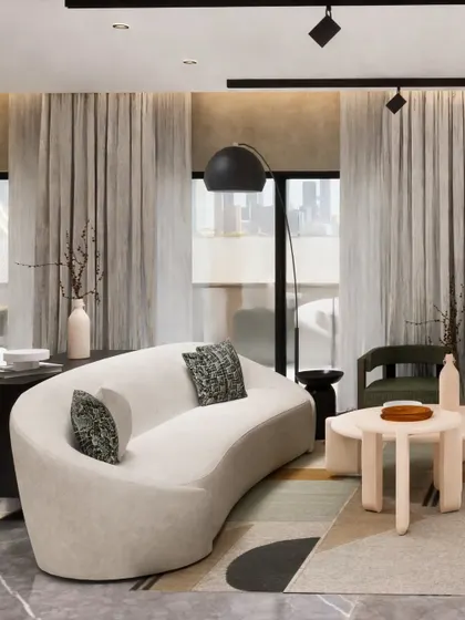 This living room concept explores a minimalist beige color scheme, creating a serene and sophisticated base. We complemented this neutral palette with a few maximalist pieces, like the sculptural green bookshelf and curved sofa, to reflect the client's unique personality.