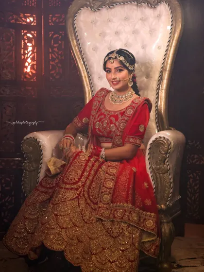 A series of portraits showcasing a model in a heavily embroidered red bridal lehenga. I focused on capturing the intricate details of the outfit and the flawless bridal makeup, presenting a look of regal elegance.