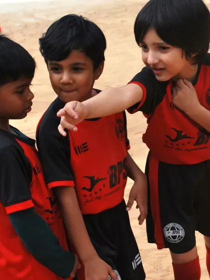 A candid moment of on-field communication between our youngest players. I teach them to be leaders and teammates right from the start.