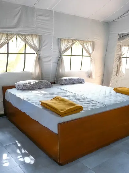 A look inside the simple and clean bedroom of a Swiss cottage.