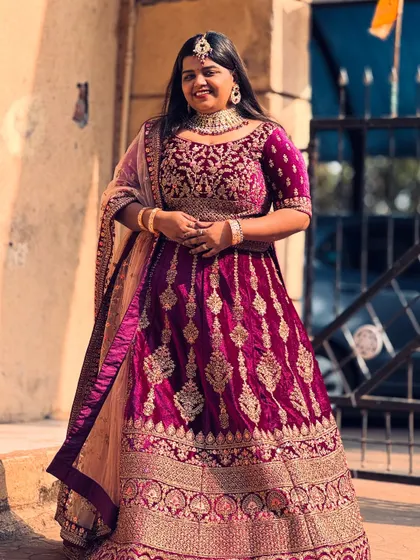 This rich magenta velvet lehenga is for the bride who wants a traditional yet unique colour. The gold embroidery shines beautifully, making it perfect for your wedding day.