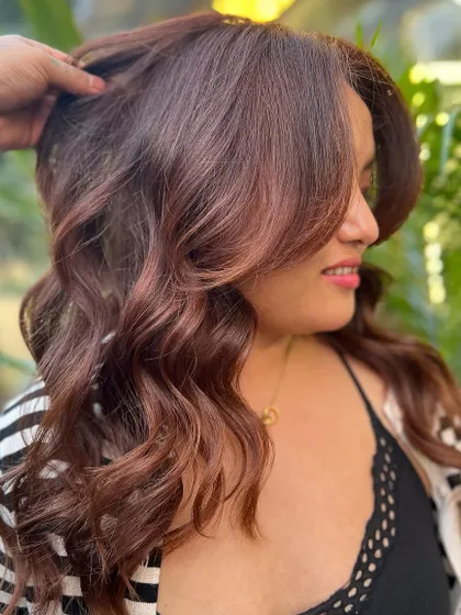 A beautiful, warm, reddish-brown color that makes the client look and feel amazing. The color is rich and vibrant.