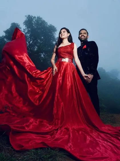 For pre-wedding photoshoots, I create looks that match the drama and romance of the setting. This bride's bold red gown is complemented by makeup that is both striking and elegant, ensuring she stands out against the beautiful Chikmagalur landscape.