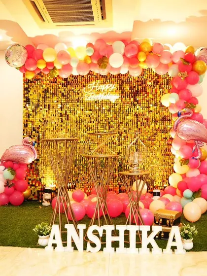 Anshika's first birthday was a glamorous flamingo party. We used a gold sequin backdrop, pink and gold balloons, and flamingo foil balloons to create a sparkling and fun celebration.