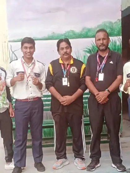 Our medal-winning students with their school coaches and staff. A strong support system is crucial for development.