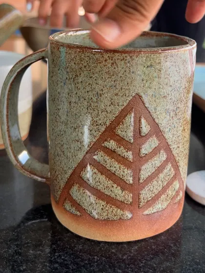 This rustic mug with a carved geometric leaf design was made by a student in my 15-day course. The texture feels wonderful to hold.