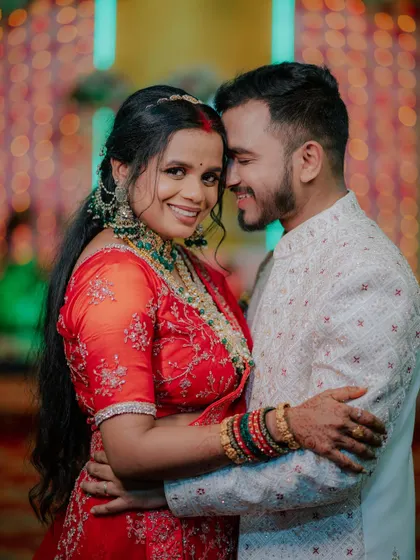 A happy and loving portrait of the couple at their wedding reception.