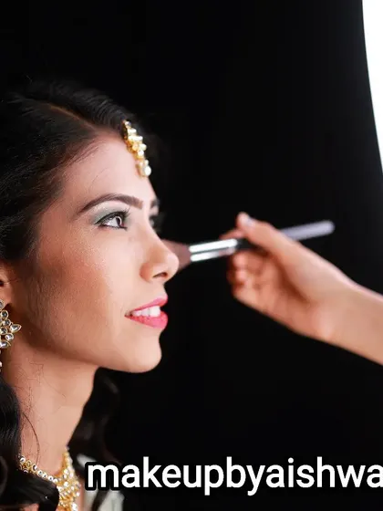 A behind the scenes moment, showing the final touches of makeup application. I use professional techniques and high quality products like Makeup Studio to ensure your look is perfect from every angle and lasts all day.