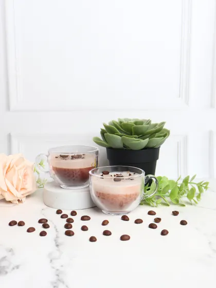 Your daily dose of caffeine, in candle form. My coffee-scented candles look and smell like a real cup of coffee, complete with coffee bean toppings. They are perfect for creating a cozy cafe vibe at home.
