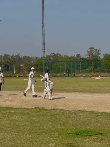The opening pair walking off the field after a successful chase.
