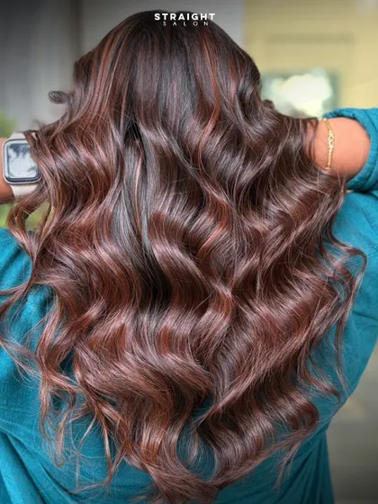 Your dream hair is just one appointment away. This photo captures the full, voluminous result of a custom color and style.