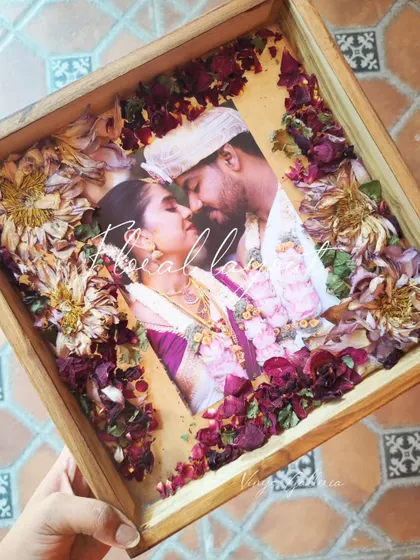 A look at the dried lotus and rose petals before they are encased in resin, a key part of the preservation process.