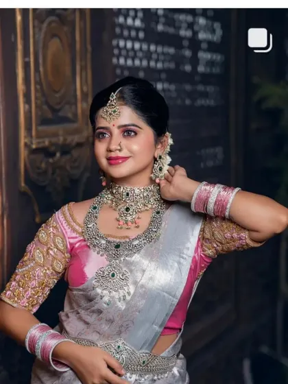A close-up of the silver saree look, showing the detailed embroidery on the blouse and the intricate jewellery.