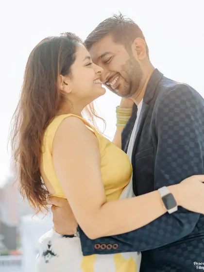 A close-up of pure joy. This pre-wedding shot captures the couple's infectious laughter and the easy, natural connection they share.