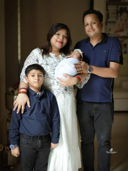 A classic, formal family portrait. Everyone is looking at the camera, making this a perfect photo for sharing with friends and extended family.