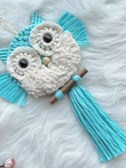 This bright sky-blue and white owl is another one of my favorite color combinations. The dark wooden beads for the eyes really make them pop.