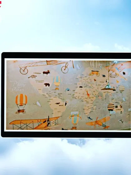 Another take on the world map theme, this one with a vintage, adventurous feel featuring old planes and hot air balloons. It's a great way to inspire a love for travel.