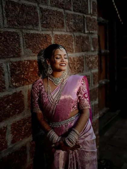 A beautiful bride framed by a traditional doorway. We use architectural elements and natural light to create artistic and striking portraits that highlight her grace.