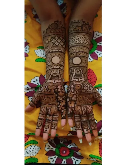 A classic engagement design with bell motifs and a space for writing names or dates, surrounded by detailed Rajasthani patterns.
