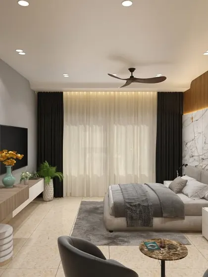 This wide view shows the complete hotel room layout, including a comfortable seating nook. The design cohesively integrates the sleeping area, a media unit, and a small lounge space using a consistent palette of wood and neutral tones.