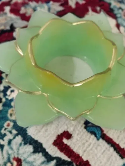 I love adding little details, like the hand-painted gold trim on this light green lotus diya holder. It gives the piece a really elegant and finished look.