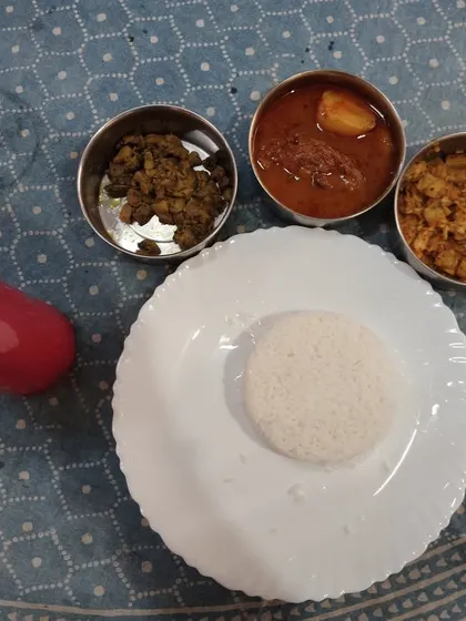 Another look at our satisfying non-veg lunch. Each meal is prepared fresh daily, ensuring you get a delicious and wholesome plate that reminds you of home.