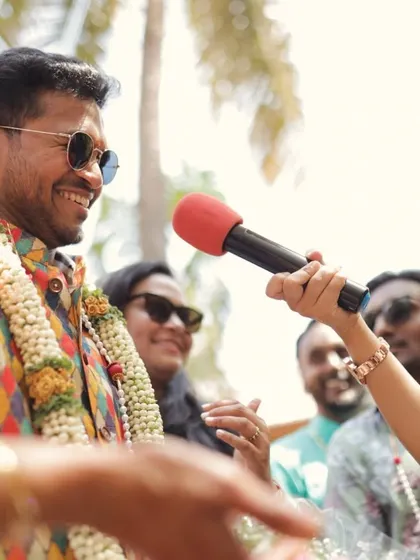 The groom responding to the bride's family's playful demands during the welcoming ceremony. These interactive moments are always a highlight.