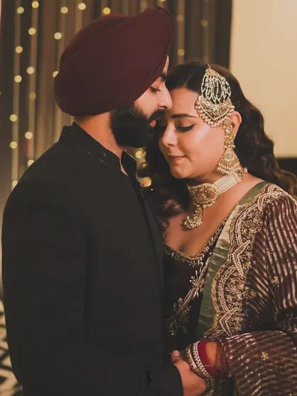 A romantic close-up of my sister and her husband. Her elegant velvet outfit and his classic black sherwani were perfect for their reception.