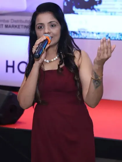 As a corporate event anchor, my role is to command the stage and guide the audience through the event's agenda. This was a moment from the Honor Mobile launch, where we combined tech reveals with live music.