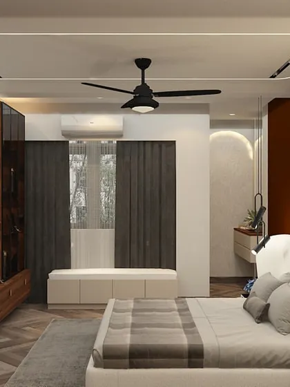 A wide view of a master bedroom, showing the TV, seating bench, and unique winged headboard design.
