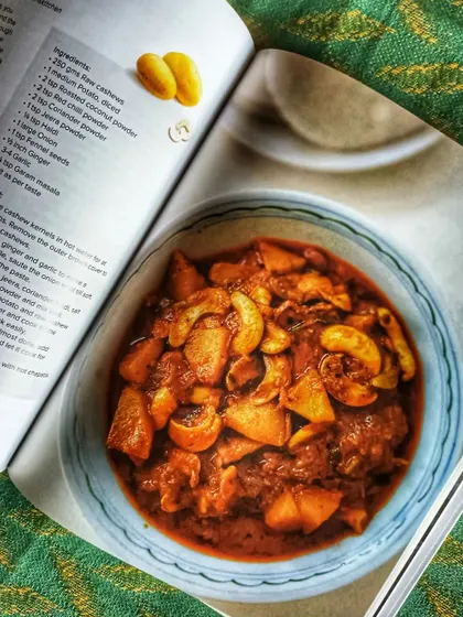 A look inside 'Memories on a Plate', showing a recipe for a cashew curry. This book is a gathering of poems, recipes, remembrances, and flavors from the Indian Kitchen.