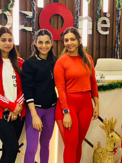 Friends in fitness. A group of members dressed in festive red, enjoying the Christmas celebrations at the club.