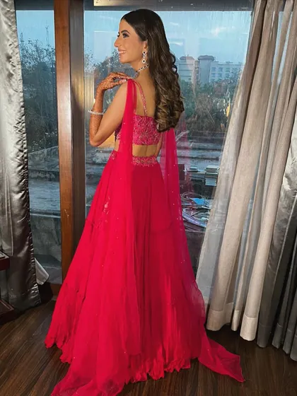 A view of the back of the engagement lehenga, showing the delicate straps and detailed embroidery on the blouse. Every angle is considered when I put together a look.