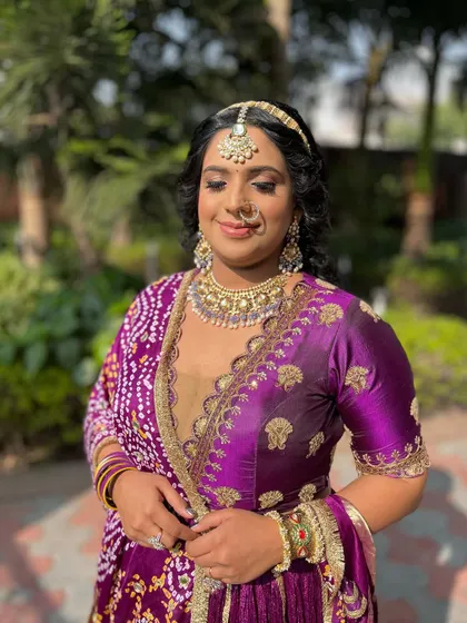 A happy client enjoying her party look. Her smile and the beautiful sunshine make this picture perfect.